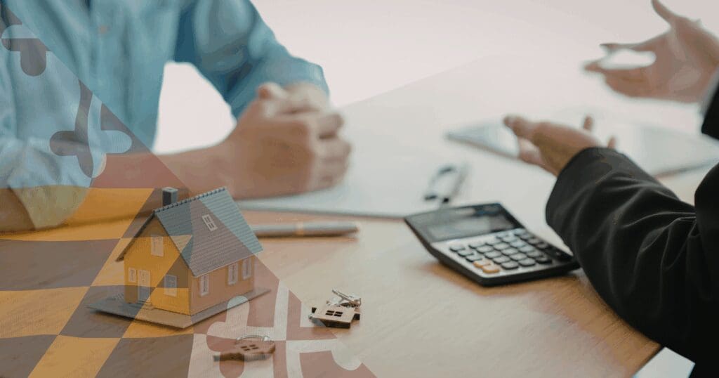 A homeowner and a local roofing consultant sitting at a desk reviewing financial documents and a calculator, with a miniature yellow model house and keys resting in the foreground. This meeting represents the strategic planning necessary when dealing with an insurance company forcing roof replacement, Maryland families need flexible financing to secure their property. A translucent Maryland flag pattern is overlaid on the right.