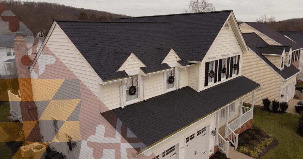 Aerial view of a flawless architectural shingle roof and seamless gutter system on a home in Maryland, showcasing the uncompromised technical precision delivered by an established, permanent local roofing company.